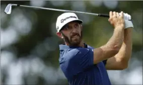  ?? ADAM HUNGER — THE ASSOCIATED PRESS ?? Dustin Johnson tees off on the second hole during final-round play at The Northern Trust golf tournament on Sunday in Old Westbury, N.Y.