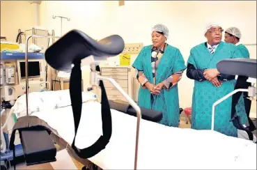  ??  ?? HOSPITAL ROUND: Minister of Health Aaron Motsoaledi and Gauteng Premier Nomvula Mokonyane inspect the newly completed maternity ward at the awaited R730m ZolaJabula­ni district hospital in Soweto at its opening.
