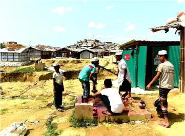  ??  ?? File photo shows Rohingya men preparing to make an offering for afternoon prayers at a refugee camp in Ukhia, Cox’s Bazar. — AFP photo