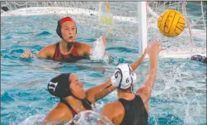  ?? DAVID WITTE/NEWS-SENTINEL ?? Above: Lodi goalkeeper Lydia Campbell, top, watches as Tokay's Mackenzye Dunn (6) takes a shot past Lodi defender Avery Hillstrom (11) during Lodi's 12-2 victory on Tuesday at Tokay. Campbell blocked the shot. Below: Lodi's Dane Cranford (15) scores on a corner shot from the perimeter during Lodi’s 20-14 victory in the boys game.