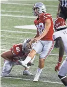  ?? JOSHUA A. BICKEL/COLUMBUS DISPATCH ?? Ohio State freshman Jake Seibert kicks an extra point against Rutgers.