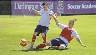  ?? Jeremy Stewart/RN-T ?? Gavin Sibayan (right) knocks the ball away from Mason Abbiate with a tackle during a training session for the U.S. Paralympic National Soccer Team at Darlington School on Thursday, July 14, 2016. The team is making final preparatio­ns before the...