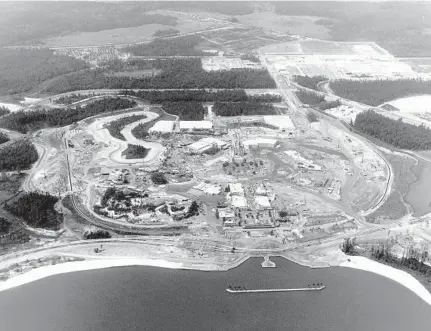  ?? WALT DISNEY CO. ?? This aerial view shows the Magic Kingdom under constructi­on with the man-made Seven Seas Lagoon at bottom. The still rising Cinderella Castle can be seen in the center of the theme park.