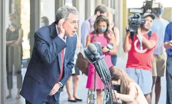  ?? — AFP photo ?? Werksman listens to a question as he speaks to the press outside the courthouse after Weinstein pleaded not guilty in Los Angeles.