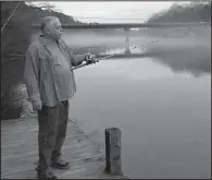  ?? Arkansas Democrat-Gazette/BRYAN HENDRICKS ?? Rick Stanton of Malvern gets ready for some night fishing below Carpenter Dam. He caught his first walleye from this spot last week.