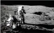  ?? NASA VIA AP ?? Apollo 14 astronaut Alan Shepard conducts an experiment near a lunar crater Feb. 13, 1971. New research shows ice — very muddy ice, mixed with lunar dust — exists inside craters where direct sunlight does not reach it.