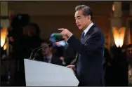  ?? (AP/Petr David Josek) ?? Secretary of State Antony Blinken (top) and Wang Yi, the Chinese Communist Party’s most senior foreign policy official, spoke at separate events Saturday in Munich before holding widely anticipate­d talks.