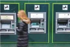  ?? Reuters ?? Cash machines outside a branch of LBG in Manchester. The bank returned to full private ownership last year.