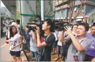  ?? YANG FAN / FOR CHINA DAILY ?? Cameramen film at the site where Zhou Kehua was shot dead in Chongqing on Tuesday.