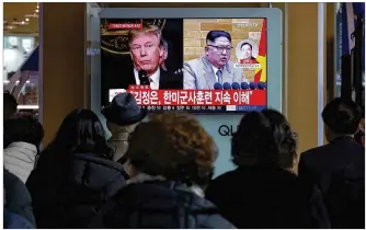  ?? AHN YOUNG-JOON / ASSOCIATED PRESS ?? People at the Seoul Railway Station in South Korea watch a TV screen Friday featuring images of President Donald Trump and North Korean leader Kim Jong Un. Kim has invited Trump to a summit, but the U.S. has pulled back, saying Kim must take certain...