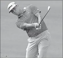  ?? AP/MATT YORK ?? Gary Woodland hits from the 10th fairway during the third round of the Sentry Tournament of Champions on Saturday at Kapalua Plantation Course in Kapalua, Hawaii. Woodland shot a 5-under 68 to maintain his three-shot lead.