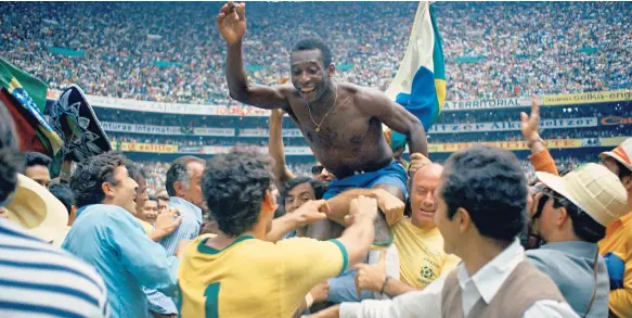  ??  ?? In this June 21, 1970 file photo, Brazil’s Pele (centre) is hoisted on the shoulders of his teammates after Brazil won the World Cup soccer final against Italy, 4-1, in Mexico City’s Estadio Azteca, Mexico. On this day: Perhaps the most glorious day in...