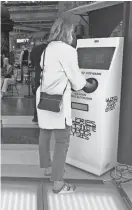  ?? KATIE JACKSON/SPECIAL TO USA TODAY ?? Instead of sticking your hands under a touchless hand sanitizer dispenser as you do in the U.S., you put your hands inside the stations at Paris’ Galeries Lafayette, a department store.