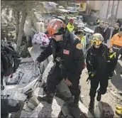  ?? Tom Nicholson ?? L.A. COUNTY Fire Department workers help the quake response in Adiyaman, Turkey, this month.