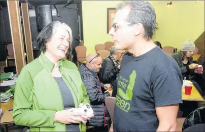  ?? MITCH MACDONALD/THE GUARDIAN ?? Green party candidate Hannah Bell chats with supporter Jordan Bober, with other campaign volunteers behind them, after a day of knocking on doors for the District 11 byelection. Bell said she hopes to bring a long-term vision to P.E.I.’s legislatur­e.