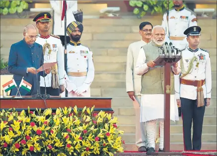  ?? AJAY AGGARWAL/HT FILE ?? ■
President Ram Nath Kovind administer­s the oath of office to Prime Minister Narendra Modi on the forecourt of Rashtrapat­i Bhavan on May 30, 2019.