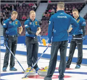  ?? CP PHOTO ?? Skip Brad Gushue talks with teammates lead Geoff Walker, third Mark Nichols and second Brett Gallant during Olympic curling trials action against Team Morris on Monday in Ottawa.