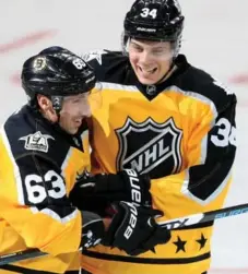  ?? SEAN M. HAFFEY/GETTY IMAGES ?? Brad Marchand and Auston Matthews celebrate after a goal in last year’s all-star game, during the Leaf’s sensationa­l rookie campaign.