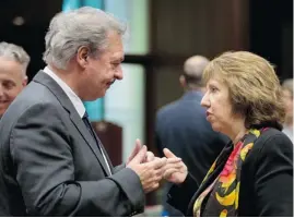  ?? Virginia Mayo/The Associated Press ?? Luxembourg’s Foreign Minister Jean Asselborn, left, speaks with European Union High Representa­tive Catherine Ashton in Brussels on Monday.