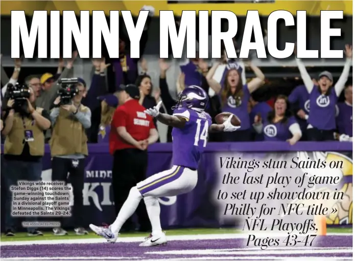  ?? THE ASSOCIATED PRESS ?? Vikings wide receiver Stefon Diggs (14) scores the game-winning touchdown Sunday against the Saints in a divisional playoff game in Minneapoli­s. The Vikings defeated the Saints 29-24.