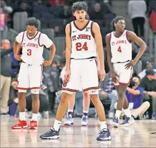  ?? Robert Sabo ?? ROUGH NIGHT: Stef Smith (left to right), Rafael Pinzon and O’Mar Stanley react at the end of the St. John’s 95-75 loss to No. 8 Kansas on Friday night.