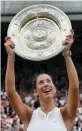  ??  ?? Muguruza efter finalvinst­en 2017.