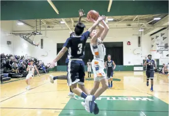  ?? BOB TYMCZYSZYN/STANDARD STAFF ?? Kennan Larmand from the Welland Centennial Cougars goes to the hoop against the St. Paul Patriots in the Review boys basketball final Friday at Westlane Secondary School.