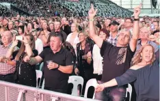  ?? PHOTO: CRAIG BAXTER ?? Entertaine­d . . . Part of the 16,000strong crowd at Saturday night’s Robbie Williams concert at Forsyth Barr Stadium.