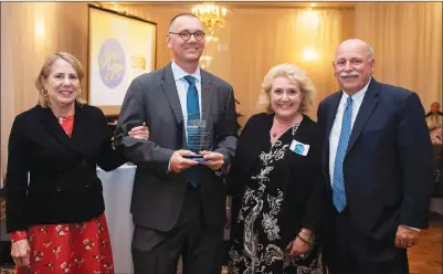  ?? Submitted photos by Jessica Pohl ?? Woonsocket Schools Superinten­dent Patrick McGee, second from left, was honored by the non-profit Connecting for Children & Families at its Oct. 23 annual meeting. Pictured with him, from left, are CCF Executive Director Terry Curtin, Woonsocket Prevention Coalition Director Lisa Carcifero and Navigant Credit Union President Gary Furtado. McGee accepted the Outstandin­g Community Leader Award.