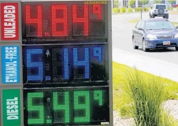  ?? RICK BOWMER/AP ?? Gasoline prices Thursday in Salt Lake City. The national average price on Friday was $4.99 per gallon.