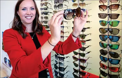  ??  ?? SPECS APPEAL: Optometris­t Ceri Smith-Jaynes says prescripti­on sunglasses are vital to combat ultraviole­t light
