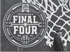  ?? DARRON CUMMINGS/AP ?? The NCAA Final Four logo for the men’s tournament is painted on a window Wednesday in downtown Indianapol­is.