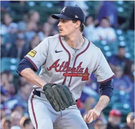  ?? DAVID BANKS/USA TODAY SPORTS ?? Atlanta Braves pitcher Max Fried throws against the Cubs during the first inning of Wednesday’s game at Wrigley Field in Chicago.