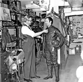  ?? Mortons’ Motorcycle Archive photo. ?? Bill Keating, then store manager, measures up Motor Cycle staff writer Mike Evans in the basement of the D. Lewis shop in London’s Great Portland Street in 1967.