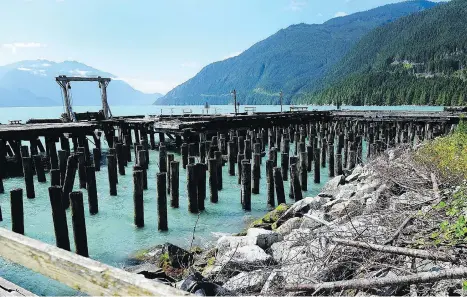  ?? NICK PROCAYLO ?? These old creosote-soaked pilings in Howe Sound will have to removed as Woodfibre LNG takes over an old pulp mill site. Workers will need to be careful to avoid stirring up old contaminan­ts that lurk in sediments on the ocean bottom.