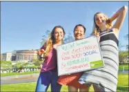  ??  ?? Wesleyan University students Ingrid Eck, Kelly Lam and Kate Sundberg enjoy last year’s Veg Out Cookout on Foss Hill in Middletown.