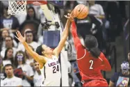  ?? Stephen Dunn / Associated Press ?? UConn’s Napheesa Collier (24) blocks the shot of Louisville’s Myisha Hines-Allen (2) in the second half on Monday.