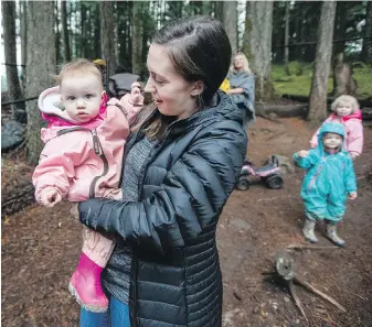  ?? DARREN STONE, TIMES COLONIST ?? Stephanie Taylor picks up her 15-month-old daughter Mackenzie from Lexie’s Little Bears Child Care in Langford, one of eight Island daycares to be chosen as prototype sites for $10-a-day daycare. Taylor says the subsidy is “life-changing.”