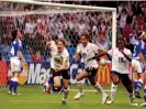  ?? Photograph: Paul Harding/Action Images/Reuters ?? Karen Carney (second left) celebrates after scoring England’s late winner against Finland in front of a record crowd at the City of Manchester Stadium.