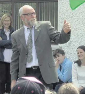  ??  ?? Oliver Kirwan raises the Green Flag at Callystown school.