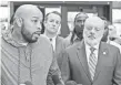  ??  ?? Leonard Gipson, 36, left, who had his conviction overturned, speaks to reporters Thursday after the ruling. MAX HERMAN/AP