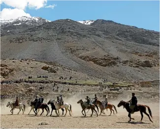  ?? REUTERS ?? Afghan horsemen compete during a Buzkashi game in Panjshir province, north of Kabul, Afghanista­n.