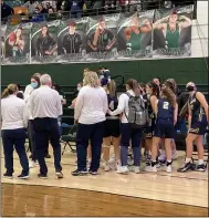  ?? ROB DIFRANCO — FOR THE MORNING JOURNAL ?? The North Ridgeville girls basketball team huddles after its 53-52district final loss to Strongsvil­le.