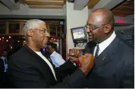  ?? AP Photo/Stuart Ramson, File ?? ■ NBA legend Julius “Dr. J’” Erving, left, greets former Milwaukee Buck Bob Lanier during LeBron James presentati­on for the NBA Rookie of the Year award April 20, 2004, at the NBA Store on New York’s Fifth Avenue. Lanier, the left-handed big man who muscled up beside the likes of Kareem Abdul-Jabbar as one of the NBA’s top players of the 1970s, died Tuesday. He was 73.