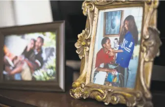  ??  ?? Family photos of Zecole Thomas and her late husband are on display in the Cary, N.C., home where Zecole and their sons moved after the suicide, fleeing California’s high cost of living.