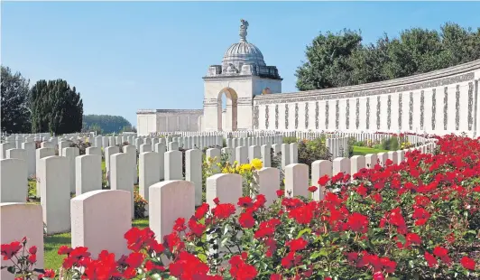  ??  ?? The Tyne Cot Cemetery in Ypres, Belgium, with its row upon row of crosses provides a stark illustrati­on of the cost of the First World War