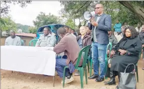  ?? (Pics: Nhlanganis­o Mkhonta) ?? Managing Director (MD) of Linac Enterprise­s, which operates OK Foods in the Kingdom of Eswatini, Lincoln Motsa, addressing Msunduza residents yesterday ahead of his business opening a new shop in the township.