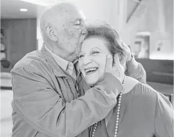  ?? Reed Saxon / Associated Press ?? Childhood Holocaust survivors Simon Gronowski and Alice Gerstel Weit embrace at the Los Angeles Holocaust Museum. “I thought the entire family was murdered,” Gerstel said. “I had no idea.”