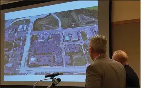  ?? DAN SOKIL - MEDIANEWS GROUP ?? Engineer John Anderson and attorney Carl Weiner show a map indicating the site of a proposed Starbucks coffee shop, at upper left and to be built next to the Marriott hotel at Sumneytown Pike (left side) and Towamencin Avenue (top center), to Towamencin’s supervisor­s on Jan. 22.