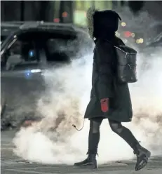  ?? ERNEST DOROSZUK/POSTMEDIA NETWORK ?? Vapour rises along King St. W in downtown Toronto earlier in December. Environmen­t Canada issued cold warnings across the county on Tuesday.